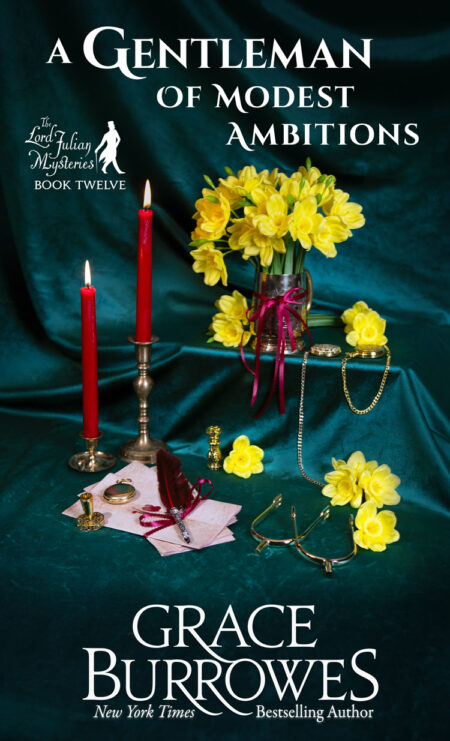 The cover for "A Gentleman of Modest Ambitions", Book 12 in the Lord Julian Mysteries series, by Grace Burrowes. A Golden cup filled with daffodils sits on an emerald green velvet background. To its left are two tall, red, lit candles in gold candlestick holders an an assortment of gold pocket watches, gold horse riding spurs, and a letter with an elaborate feather quill laid on top of it.